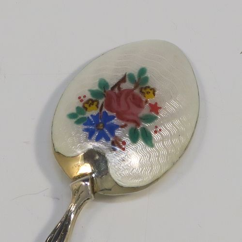 An extremely pretty Antique Sterling Silver and enamelled set of six tea or coffee spoons, having hand-painted and enamelled spoon backs in a floral design, all in their original cream satin and velvet-line presentation box. These beautiful antique silver and enamelled spoons were made by Turner and Simpson of Birmingham in 1915. The dimensions of this fine hand-made set of silver and enamelled teaspoons or coffee spoons are length of each spoon 10 cms (4 inches), and the total weight is approx. 66g (2.1 troy ounces). Please note that the enamel is in perfect order which is rare to find in spoons of this age.