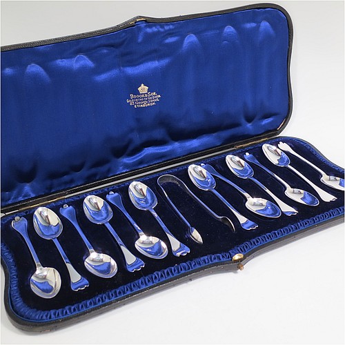 An Antique Victorian Sterling Silver set of 12 teaspoons and sugar nips in the Trefid End pattern, having plain oval bowls and handles, all in their original dark blue satin and velvet-lined presentation box. Made by Jackson and Fullerton of London in 1900. The dimensions of this fine hand-made antique silver set of sugar nips teaspoons are length of each spoon 11.5 cms (4.5 inches), and the total weight is approx. 159g (5 troy ounce).    