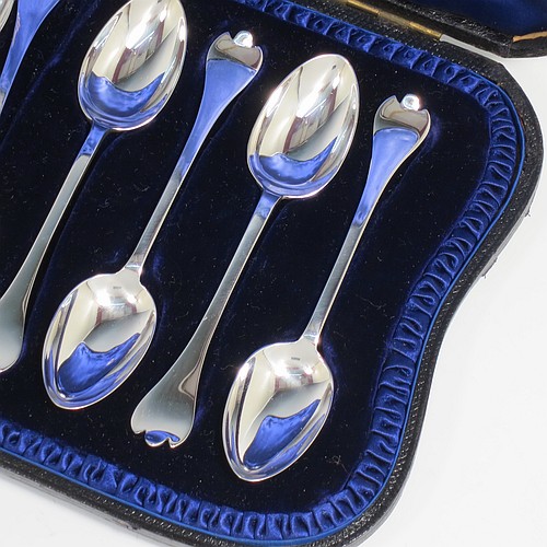 An Antique Victorian Sterling Silver set of 12 teaspoons and sugar nips in the Trefid End pattern, having plain oval bowls and handles, all in their original dark blue satin and velvet-lined presentation box. Made by Jackson and Fullerton of London in 1900. The dimensions of this fine hand-made antique silver set of sugar nips teaspoons are length of each spoon 11.5 cms (4.5 inches), and the total weight is approx. 159g (5 troy ounce).