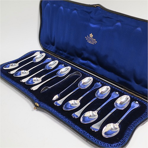 An Antique Victorian Sterling Silver set of 12 teaspoons and sugar nips in the Trefid End pattern, having plain oval bowls and handles, all in their original dark blue satin and velvet-lined presentation box. Made by Jackson and Fullerton of London in 1900. The dimensions of this fine hand-made antique silver set of sugar nips teaspoons are length of each spoon 11.5 cms (4.5 inches), and the total weight is approx. 159g (5 troy ounce).
