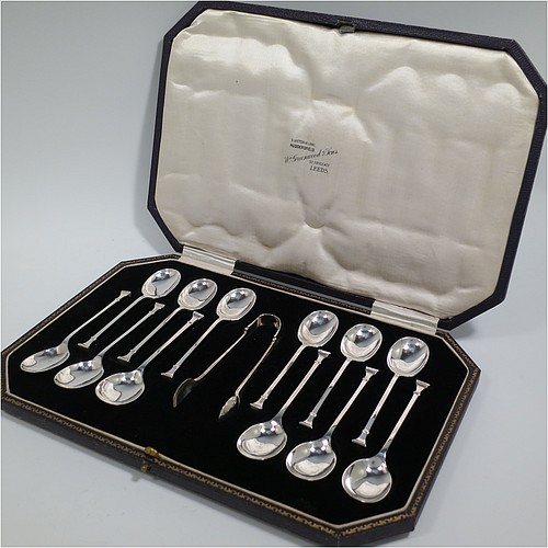 An Art Deco Sterling Silver set of 12 teaspoons or coffee spoons and sugar nips, having plain oval bowls, and handles in the Nail-End pattern, all in original cream satin and black velvet-lined presentation box. Made by the Cooper Brothers and Sons of Sheffield in 1923. The dimensions of this fine hand-made set of coffee spoons or teaspoons are length of each spoon 10 cms (4 inches), and the total weight is approx. 148g (4.8 troy ounce).