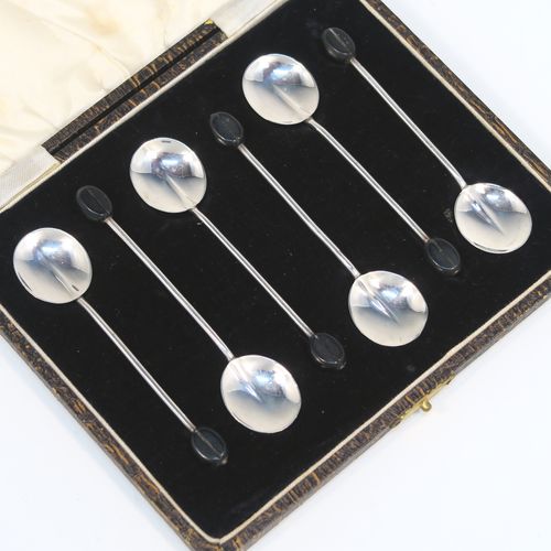 A handsome set of six Sterling Silver coffee spoons, having plain round bowls, and plain stems with wooden black stained coffee bean ends, all in their original cream satin and black velvet-lined presentation box. These elegant silver coffee spoons were made by the Adie Brothers of Birmingham in 1930. The dimensions of this fine hand-made set of coffee spoons are length of each spoon 9 cms (3.5 inches), and the total weight is approx. 31g (1 troy ounce).