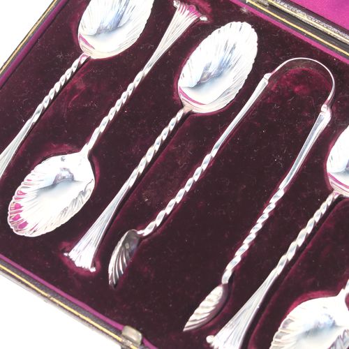 A very pretty Antique Victorian Sterling Silver set of six tea or coffee spoons and sugar nips, in the Onslow pattern, with twisted stems, and fluted oval bowls, all in their original dark maroon satin and velvet-lined presentation box. These beautiful antique silver spoons and sugar nips were made by George Maudsley Jackson of London 1886. The dimensions of this fine hand-made set of silver teaspoons or coffee spoons and sugar nips are length of each spoon 12 cms (4.75 inches), and the total weight is approx. 102g (3.3 troy ounces).