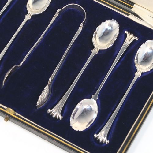 A very pretty Antique Victorian Sterling Silver set of six teaspoons and sugar nips in the Onslow pattern, having unusual oval bowls with lobed decoration and fluting on the reverse, all in their original cream satin and dark blue velvet-lined presentation box. These beautiful silver teaspoons and sugar nips were made by Charles Stuart Harris of London in 1894. The dimensions of this fine hand-made set of teaspoons are length of each spoon 11 cms (4.25 inches), and the total weight is approx. 93g (3 troy ounce).
