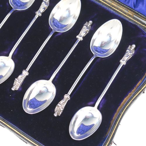 A handsome Antique Victorian Sterling Silver set of twelve Apostle end teaspoons or coffee spoons and sugar nips, all in their original dark blue satin and velvet-lined presentation box. This elegant set of antique silver Apostle spoons and sugar nips were made by William Hutton and Sons of London in 1898. The dimensions of this fine hand-made set of Apostle end coffee spoons or teaspoons are length of each spoon 10 cms (4 inches), and the total weight is approx. 185g (6 troy ounce).