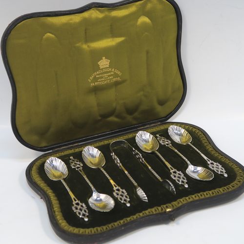A stunning Antique Edwardian Sterling Silver set of six tea or coffee spoons and sugar nips, with twisted stems, fluted oval bowls, and hand-pierced handles, all in their original olive satin and dark-green velvet-lined presentation box. These beautiful antique silver spoons and sugar nips were made by Jackson and Fullerton of London in 1904. The dimensions of this fine hand-made set of silver teaspoons or coffee spoons and sugar nips are length of each spoon 12 cms (4.75 inches), and the total weight is approx. 113g (3.6 troy ounces).  