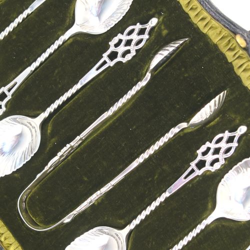 A stunning Antique Edwardian Sterling Silver set of six tea or coffee spoons and sugar nips, with twisted stems, fluted oval bowls, and hand-pierced handles, all in their original olive satin and dark-green velvet-lined presentation box. These beautiful antique silver spoons and sugar nips were made by Jackson and Fullerton of London in 1904. The dimensions of this fine hand-made set of silver teaspoons or coffee spoons and sugar nips are length of each spoon 12 cms (4.75 inches), and the total weight is approx. 113g (3.6 troy ounces).