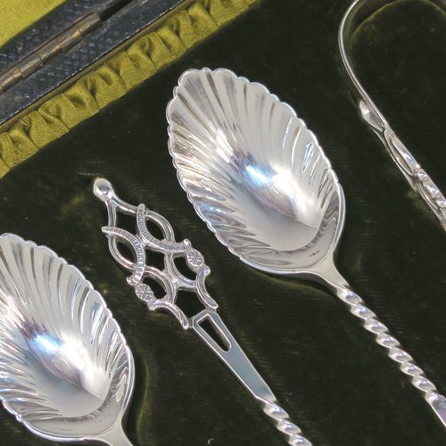 A stunning Antique Edwardian Sterling Silver set of six tea or coffee spoons and sugar nips, with twisted stems, fluted oval bowls, and hand-pierced handles, all in their original olive satin and dark-green velvet-lined presentation box. These beautiful antique silver spoons and sugar nips were made by Jackson and Fullerton of London in 1904. The dimensions of this fine hand-made set of silver teaspoons or coffee spoons and sugar nips are length of each spoon 12 cms (4.75 inches), and the total weight is approx. 113g (3.6 troy ounces).