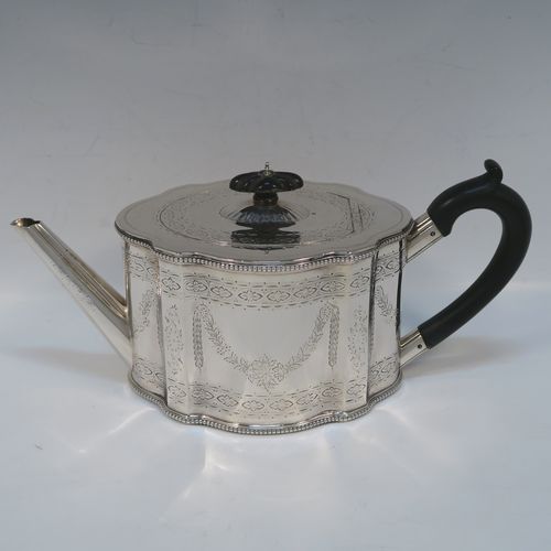 A heavy and very pretty Antique Victorian Sterling Silver three-piece tea set, consisting of a teapot, sugar bowl, and cream jug, having shaped oval bodies with straight sides, applied bead-edged borders, and hand-engraved Neoclassical style decoration, the teapot with a black wooden handle, finial, and a hinged lid with a flat invisible hinge, the sugar and creamer with scroll handles, gold-gilt interiors, and all sitting on flat bases. This beautiful silver three-piece tea set was made by Joseph Angell II and Robert Harper of London in 1872. The dimensions of this fine hand-made silver tea set are height of teapot 13.5 cms (5.3 inches), length 29 cms (11.5 inches), and it weighs a total of approx. 1,240g (44 troy ounces).