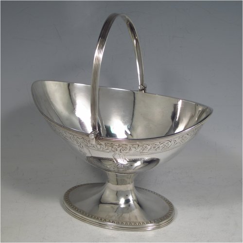 An Antique Georgian Sterling silver three-piece Neoclassical style tea set, having a teapot, sugar bowl and cream jug. The bodies all hand-engraved with bands of floral decoration and central cartouches, the sugar and creamer with applied reeded borders and pedestal feet, the teapot with wooden handle and finial, a flat base, and an invisibly hinged lid. Made by Samuel Meriton II of London in 1790/91. The dimensions of this fine hand-made silver tea service are length of teapot 27 cms (10.5 inches), height 14 cms (5.5 inches), and it weighs a total of approx. 830g (26.8 troy ounces). Please note that the teapot handle has had a small old repair close to the pins, but it does not affect the teapots usability, or deter from its prettiness.