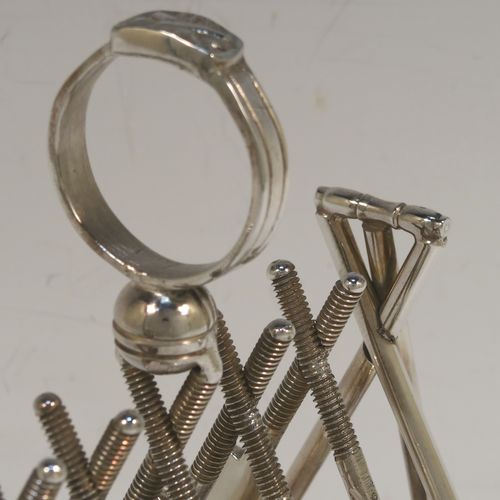 A very unusual Antique Victorian Silver-Plated seven-bar toast-rack, having crossed cricket bats with wickets and bails, and sitting on a rounded rectangular base with four cricket ball feet, and a round loop handle. This beautiful and rare Cricket designed toastrack was made by Padley, Parkin and Co., of Sheffield in ca. 1880. The dimensions of this fine hand-made antique silver plated cricket toast-rack are length 18 cms (7 inches), height 16 cms (6.3 inches), and width 8 cms (3.25 inches).