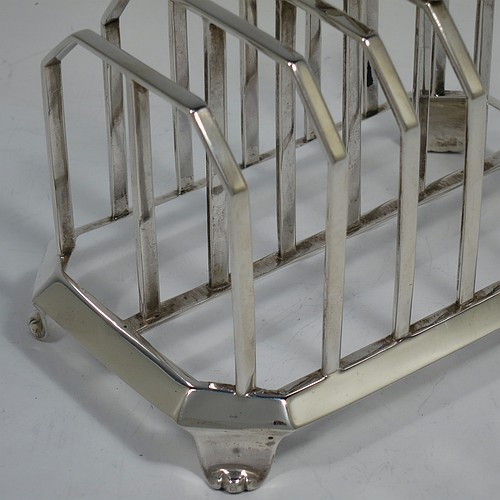 A very handsome and unusual Antique Victorian Sterling Silver seven-bar toast-rack, having plain panelled wire-work bars with central struts, a wire-work diamond-shaped handle, attached to a plain cut-corner rectangular base with a strengthening strut, and sitting on four cast flanged feet. Made by Charles and George Fox of London in 1844. The dimensions of this fine hand-made antique silver toast-rack are length 16 cms (6.3 inches), height 15 cms (6 inches), width 10 cms (4 inches), and it weighs approx. 375g (12 troy ounces).