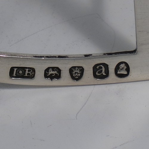 A very handsome Antique Georgian Sterling Silver seven-bar toast-rack, having rectangular shaped wire-work bars with hand-chased reeded decoration, a rectangular handle with vacant cartouche panel below, all attached to a flat rectangular base with strengthening struts, and sitting on four ball feet. Made by Joseph Biggs of London in 1816. The dimensions of this fine hand-made antique silver toast-rack are length 17 cms (6.75 inches), height 11 cms (4.25 inches), width 9 cms (3.5 inches), and it weighs approx. 162g (5.2 troy ounces).