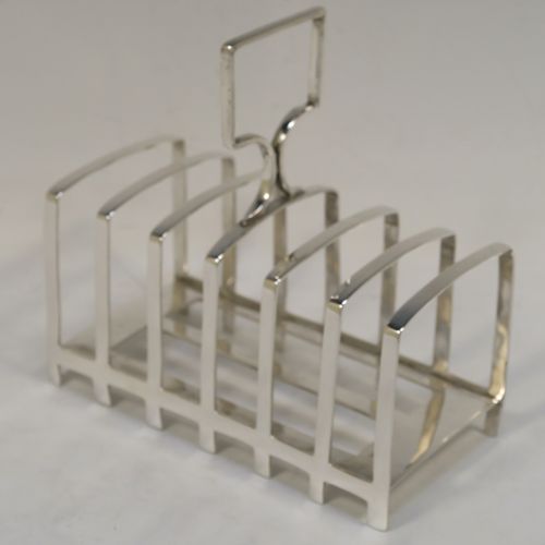 An elegant Antique Art Deco Sterling Silver seven-bar toast-rack, in a very angular style design, with a square-shaped handle, all attached to a rectangular base with strengthening strut, and sitting on multiple legs. This handsome silver toastrack was made by James Dixon and Sons of Sheffield in 1922. The dimensions of this fine hand-made Art Deco antique silver toast-rack are length 13.5 cms (5.25 inches), height 13.5 cms (5.25 inches), width 7 cms (2.75 inches), and it weighs approx. 212g (6.8 troy ounces).