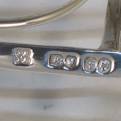 A heavy and elegant Antique Victorian Sterling Silver seven-bar toast-rack, having oval shaped wire-work bars, a cast scroll loop handle, attached to a rectangular base with a strengthening strut, and sitting on four cast shell and scroll feet. This beautiful antique silver toastrack was made by Joseph and John Angell of London in 1841. The dimensions of this fine hand-made antique silver toast-rack are length 16 cms (6.3 inches), height 14 cms (5.5 inches), width 11 cms (4.3 inches), and it weighs approx. 300g (9.7 troy ounces).