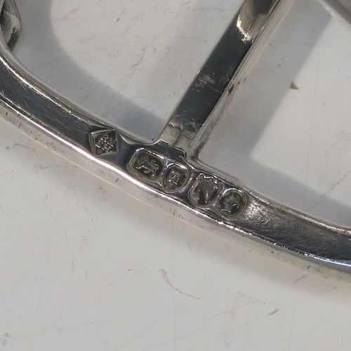 A very elegant Antique Victorian Sterling Silver seven-bar toastrack, having plain shaped cross-section wire-work bars, a matching loop handle, and all sitting on a rectangular base with four cast octagonal panelled feet. This handsome antique silver toast-rack was made by Martin and Hall of London in 1888. The dimensions of this fine hand-made antique silver toast-rack are length 13.5 cms (5.25 inches), height 11 cms (4.25 inches), width 8.5 cms (3.3 inches), and it weighs approx. 203g (6.5 troy ounces).
