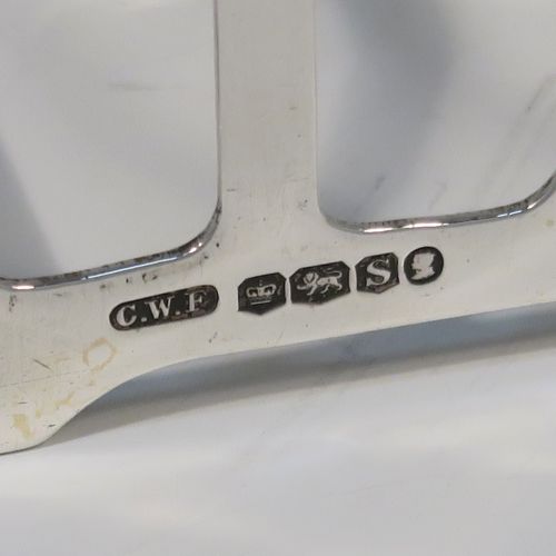 An elegant Art Deco Sterling Silver seven-bar toast-rack, in a very angular style design, with a square-shaped handle, all attached to a rectangular base, and sitting on four flange legs. This handsome silver toastrack was made by C. W. Fletcher of Sheffield in 1935. The dimensions of this fine hand-made Art Deco silver toast-rack are length 11.5 cms (4.5 inches), height 8 cms (3 inches), width 5 cms (2 inches), and it weighs approx. 91g (3 troy ounces).