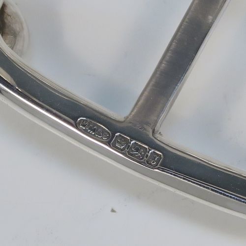 A very elegant Antique Victorian Sterling Silver seven-bar toastrack, having plain shaped cross-section wire-work bars, a round loop handle, and all sitting on a rectangular base with a strengthening strut and with four cast ball feet. This handsome antique silver toast-rack was made by William Morton and Sons of Sheffield in 1899. The dimensions of this fine hand-made antique silver toast-rack are length 15 cms (6 inches), height 13 cms (5 inches), width 9 cms (3.5 inches), and it weighs approx. 234g (7.5 troy ounces).