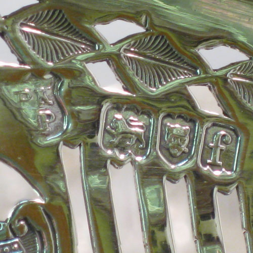 Antique Victorian sterling silver gallery tray, having an octagonal body, with an engraved ground with neoclassical style hand-engraving, a hand-pierced gallery border with shaped gadroon edge and cut-out handles, all sitting on four cast foliate feet. This very handsome sterling silver tray was made by Page, Keen, and Page of London in 1901. The dimensions of this fine hand-made silver gallery tray are length 53 cms (21 inches), width 35 cms (13.75 inches), height 8.5 cms (3.3 inches), and it weighs approx. 3,161g (102 troy ounces).