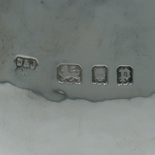 A very unusual pair of Sterling Silver trophy cups and covers, in an Arts and Crafts style, having round bellied bodies with hand-hammered decoration, applied zigzag borders and cut-card work, two side scroll handles with beaded thumb-pieces, removable covers with spiral finials, and all sitting on stepped pedestal feet. Made by D. and J. Wellby of London in 1931. The dimensions of these fine hand-made silver trophy cups and covers are height 17.5 cms (7 inches), spread across arms 15 cms (6 inches), and they weigh a total of approx. 825g (26.6 troy ounces).