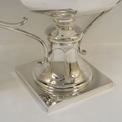 A very handsome and heavy Antique Edwardian Sterling Silver two-handled trophy cup bowl, having a plain hexagonal panelled body, two cast scroll side-handles, and sitting on a square pedestal foot. This elegant antique silver trophy bowl cup was made by Charles Clement Pilling of Sheffield in 1909. The dimensions of this fine hand-made sterling silver trophy cup bowl are height 28.5 cms (11.25 inches), width across handles 37 cms (14.5 inches), and it weighs approx. 2,133g (68.8 troy ounces).   