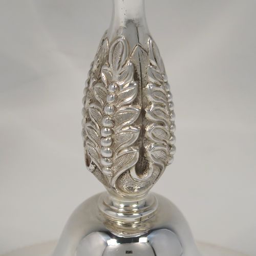 A large and handsome Antique Edwardian Silver-Plated goblet style trophy cup, having a plain round bellied body, sitting on a plain round pedestal foot with an applied bead-edged border, and with a cast floral central leaf stem. This elegant silver plated goblet trophy was made by Mappin and Webb of London in ca. 1910. The dimensions of this large and fine hand-made antique silver-plated trophy goblet cup are height 28 cms (11 inches), and diameter at lip 12 cms (4.75 inches).