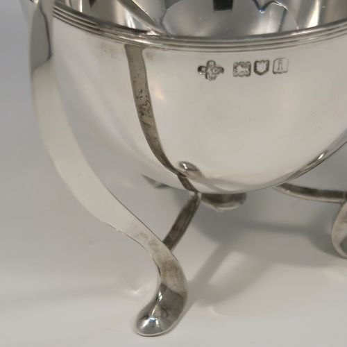 A small but very elegant and heavy Antique Edwardian Sterling Silver three-handled Loving cup bowl, having a plain round body with tapering sides and an applied reeded top border, sitting on three scroll side-handled feet. This handsome antique silver loving cup trophy bowl was made by Horace Woodward of London in 1904. The dimensions of this fine hand-made sterling silver trophy cup bowl are height 11 cms (4.25 inches), diameter of main body 10 cms (4 inches), and it weighs approx. 242g (7.8 troy ounces).