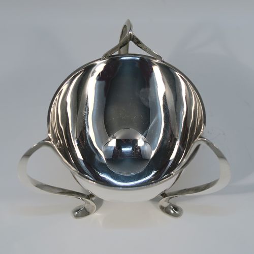 A small but very elegant and heavy Antique Edwardian Sterling Silver three-handled Loving cup bowl, having a plain round body with tapering sides and an applied reeded top border, sitting on three scroll side-handled feet. This handsome antique silver loving cup trophy bowl was made by Horace Woodward of London in 1904. The dimensions of this fine hand-made sterling silver trophy cup bowl are height 11 cms (4.25 inches), diameter of main body 10 cms (4 inches), and it weighs approx. 242g (7.8 troy ounces).