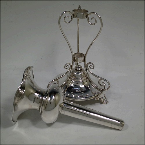 A very pretty and unusual pair of Antique Edwardian Sterling Silver Art Nouveau style vases, having removable central bodies, sitting in a frame with wire-work scrolls, attached to round bases with three scroll feet. Made by Walker and Hall of Sheffield in 1907. The dimensions of this fine pair of hand-made antique silver Art Nouveau vases are height 24 cms (9.5 inches), and diameter at bases 11 cms (4.3 inches). Please note that these vases are not loaded, and the total weight of silver is 640g (20.6 troy ounces)..