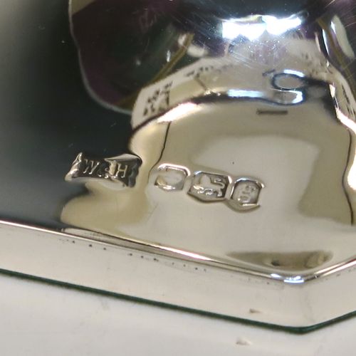 A very pretty pair of Sterling Silver table flower vases, having plain round bodies with tapering sides, with hand-pierced and applied rope-twist top borders, and sitting on plain hexagonal pedestal feet. These beautiful silver vases were made by Walker and Hall of Sheffield in 1924. The dimensions of this fine hand-made silver pair of vases are height 19 cms (7.5 inches), and width at top 10 cms (4 inches).