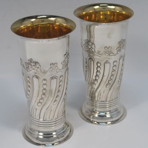 A very pretty Antique Victorian Sterling Silver pair of table flower vases, having round bodies with tapering sides and hand-chased fluting, and bead work decoration, and sitting on pedestal feet. These beautiful silver vases were made by D. and J. Welby of London in 1896. The dimensions of these fine hand-made antique silver pair of vases are height 15 cms (6 inches), diameter at top 7.5 cms (3 inches), and they weigh at total of approx. 310g (10 troy ounces). Please note that these vases are not loaded, so the whole weight is silver.   