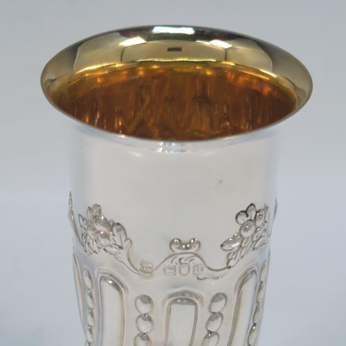 A very pretty Antique Victorian Sterling Silver pair of table flower vases, having round bodies with tapering sides and hand-chased fluting, and bead work decoration, and sitting on pedestal feet. These beautiful silver vases were made by D. and J. Welby of London in 1896. The dimensions of these fine hand-made antique silver pair of vases are height 15 cms (6 inches), diameter at top 7.5 cms (3 inches), and they weigh at total of approx. 310g (10 troy ounces). Please note that these vases are not loaded, so the whole weight is silver.