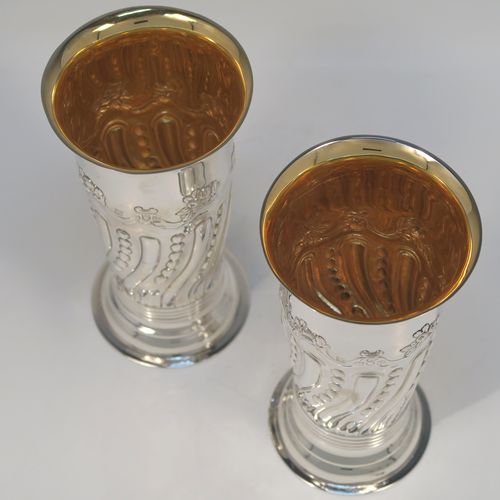 A very pretty Antique Victorian Sterling Silver pair of table flower vases, having round bodies with tapering sides and hand-chased fluting, and bead work decoration, and sitting on pedestal feet. These beautiful silver vases were made by D. and J. Welby of London in 1896. The dimensions of these fine hand-made antique silver pair of vases are height 15 cms (6 inches), diameter at top 7.5 cms (3 inches), and they weigh at total of approx. 310g (10 troy ounces). Please note that these vases are not loaded, so the whole weight is silver.