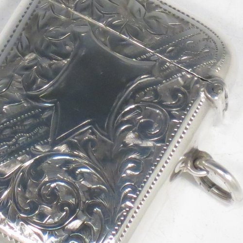 An Antique Edwardian Sterling silver Vesta case, having a rectangular body, with hand-engraved floral decoration, a hinged lid with security ring for attaching to a chain, a gold-gilt interior, and a vacant cartouche on one side. Made in Birmingham in 1905. The dimensions of this fine hand-made antique silver Vesta case are length 5.5 cms (2.2 inches), width 4 cms (1.5 inches), and it weighs approx. 29g (1 troy ounce).