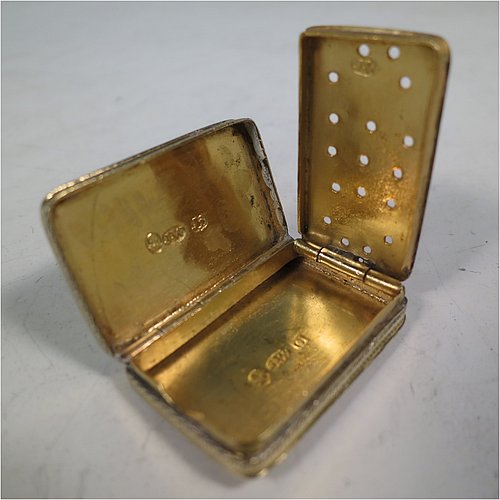 An Antique Georgian Sterling Silver and gold-gilt vinaigrette, having a rectangular body with hand-engraved floral decoration, a hinged lid, a gold-gilt interior with hinged geometrically pierced and engraved grill. Made by Joseph Wilmore, of Birmingham in 1812. The dimensions of this fine hand-made antique silver vinaigrette are length 3.2 cms (1.25 inches), width 2 cms (0.75 inches), and depth 0.8 cms (0.3 inches).