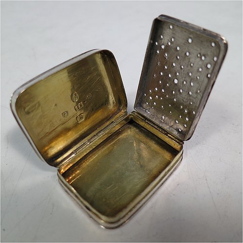 An Antique Georgian Sterling Silver vinaigrette, having hand-engraved greek-key decoration on the top and hand-engraved floral decoration on the base, a gold-gilt interior, and a plain hand-pierced grill. Made by John Shaw of Birmingham in 1803. The dimensions of this fine hand-made antique silver vinaigrette are length 3.5 cms (1.3 inch), width 2.2 cm (1 inch), and depth 0.8 cm (0.3 inches).   
