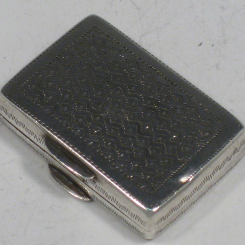 Antique Georgian sterling silver purse-form vinaigrette, having a rectangular body with hand-engraved decoration, a hinged lid, a gold-gilt interior with hinged hand-pierced and chased grill with floral decoration. Made by John Bettridge of Birmingham in 1833. The dimensions of this fine hand-made silver vinaigrette are length 3 cms (1.25 inches), and width 2 cms (0.75 inches).
