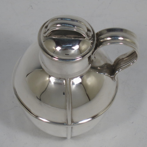 A small but handsome and unusual Antique Victorian Sterling Silver Guernsey style water / milk jug for one person, having a plain round bellied body with applied reeded girdles, a scroll handle, a pull-off lid, and all sitting on a flat base. Made by the Barnard Brothers of London in 1895. The dimensions of this fine hand-made antique silver Guernsey jug are height 9.5 cms (3.75 inches), diameter of body 7 cms (2.75 inches), and it weighs approx. 90g (3 troy ounces).