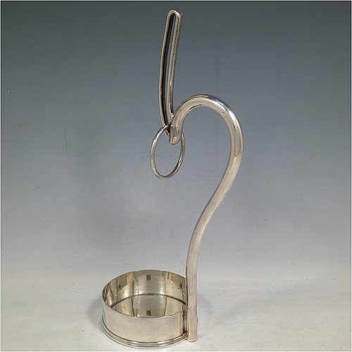 An Antique Edwardian Silver Plated wine bottle cradle or holder, having a plain round straight-sided base, and a scroll handle with sliding neck loop. Made by Harrison Brothers & Howson. The dimensions of this fine hand-made antique silver plated wine bottle holder or cradle are height 31 cms (12.5 inches), and diameter of base 10 cms (4 inches). Please note that this wine bottle cradle or holder will accept a 75cl bottle, (bottle shown for display purposes only).