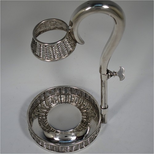An Antique Victorian Silver Plated wine bottle cradle or holder, having a round straight-sided base with basket-weave hand-pierced decoration, a plain sliding scroll handle with matching basket weave neck and retaining screw. Made by J. and B. of Sheffield in ca. 1870. The dimensions of this fine hand-made antique silver-plated wine bottle holder or cradle are height 26 cms (10 inches), or 33 cms (13 inches) extended, and diameter of base 11.5 cms (4.5 inches). Please note that this wine bottle cradle or holder will accept a 75cl bottle, (bottle shown for display purposes only).