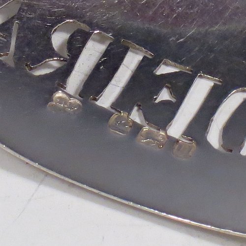 A rare 18th century Antique Georgian Sterling Silver wine decanter label, having a plain elongated oval shaped body, with a reeded border, hand-pierced for Madeira, and with its original bottle chain. Made by Thomas Phipps & Edward Robinson of London 1795. The dimensions of this fine hand-made antique silver decanter wine label are height 2.5 cms (1 inch), length 4.5 cms (1.75 inches), and it weighs approx. 10g (0.32 troy ounces).