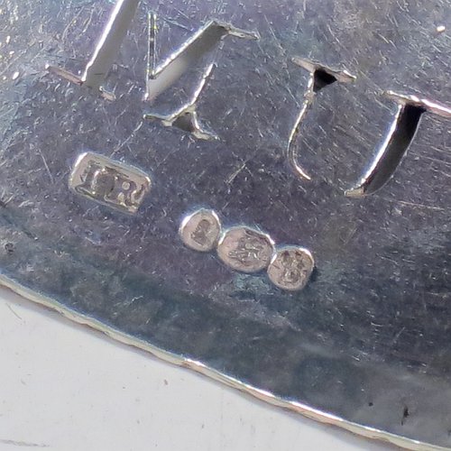 A rare set of three Antique Georgian Sterling Silver wine decanter labels, having plain elongated oval shaped bodies, with hand-chased gadroon borders, all hand-pierced for Gin, Rum, and Brandy, and with their original bottle chains. Made by John Reily of London in 1817. The dimensions of these fine hand-made antique silver decanter wine labels are height 2.5 cms (1 inch), length 4.5 cms (1.75 inches), and they weigh a total of approx. 44g (1.4 troy ounces).