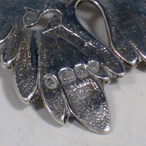 An Antique Georgian Sterling Silver wine decanter label, having a shaped vine-leaf and branch body, all hand-chased with vein and stipple work, hand-pierced for Sherry, and with its original bottle chain. Made by George Rawlings of London in 1823. The dimensions of this fine hand-made antique silver decanter wine label are height 6 cms (2.3 inches), length 8 cms (3 inches), and it weighs approx. 25g (0.8 troy ounces).