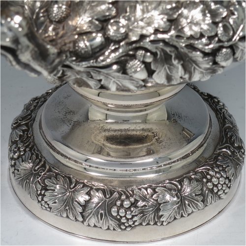An Antique Georgian Old Sheffield plated wine cooler, in the Campagna style, with cast grape & vine borders, a pair of cast handles, and an applied oak acorn & leaf band running round the body. All with original interior and cover. Made in ca. 1825. The dimensions of this fine hand-made antique Old Sheffield wine cooler are height 29 cms (11.5 inches), width across handles 25 cms (9.75 inches). Please note that this item has an original crested inlet cartouche.