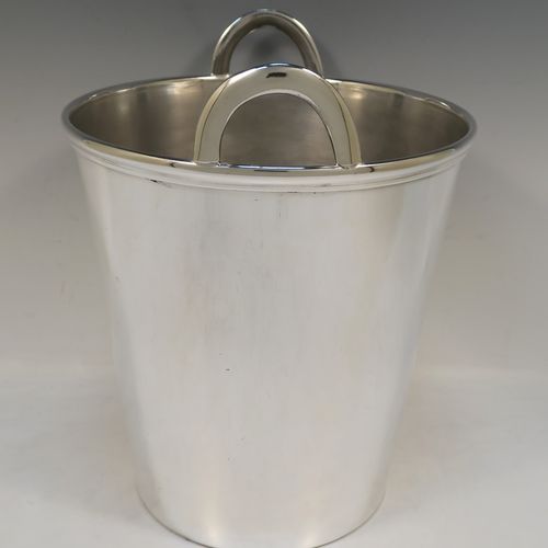 A large and very elegant Art Deco style Silver Plated wine bottle cooler, having a plain round body with tapering sides, and two cast loop side-handles, all sitting on a flat base. This beautiful silver-plated wine cooler was made in ca. 1930. The dimensions of this fine hand-made silver-plated Art Deco wine cooler are height 27 cms (10.5 inches), and diameter at lip 22 cms (8.75 inches). Please note that this will easily hold two normal size wine bottles.