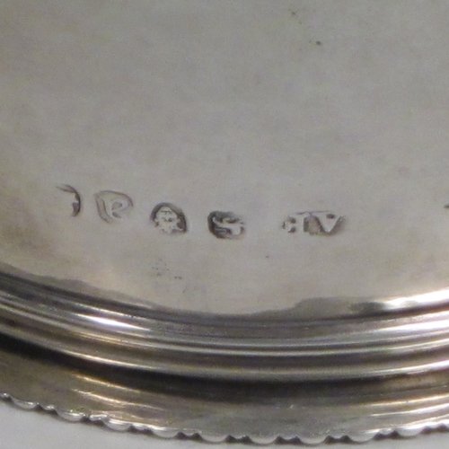 Antique Georgian sterling silver wine decanting funnel, having a round body with hand-chased half-fluted decoration, and a pull out strainer with a shell clip and gadroon border. Made by Alexander Field of London in 1816. The dimensions of this fine hand-made silver wine decanting funnel are height 15 cms (6 inches), diameter of cup 8.5 cms (3.25 inches), and it weighs approx. 117g (3.7 troy ounces).