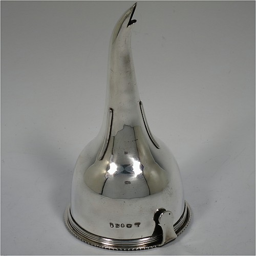 An Antique Georgian Sterling Silver wine decanting funnel, having a round body with applied reeded border and funnel struts (that allow proper aeration when decanting), a pull out hand-pierced strainer with an applied gadroon border and shaped clip, and an original muslin ring. Made by Rebecca Emes and Edward Barnard of London in 1808. The dimensions of this fine hand-made antique silver wine decanting funnel are height 15 cms (6 inches), diameter of cup 8.5 cms (3.3 inches), and it weighs approx. 162g (5.2 troy ounces).    