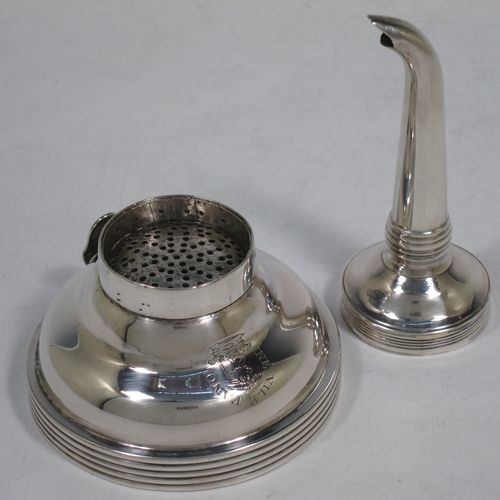 A handsome Antique Georgian Sterling Silver wine decanting funnel, having a plain round body with applied reeded borders, and removable funnel. Made by Soloman Hougham of London in 1810. The dimensions of this fine hand-made antique silver wine decanting funnel are height 13 cms (5 inches), diameter of bowl 8 cms (3 inches), and it weighs approx. 96g (3 troy ounces).