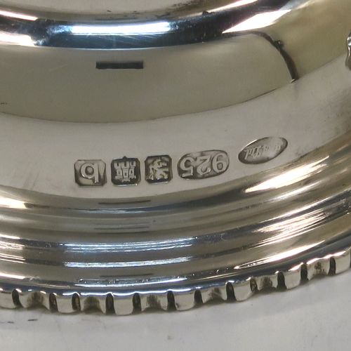 An elegant Scottish Sterling Silver wine decanting funnel, having a plain round body with a gold-gilt interior and applied gadroon borders, a cast shell side clip, and removable funnel. This handsome silver wine decanting funnel was made by Goodwins of Edinburgh in 2001. The dimensions of this fine hand-made silver wine decanting funnel are height 13 cms (5 inches), diameter of bowl 8 cms (3 inches), and it weighs approx. 127g (4 troy ounces).