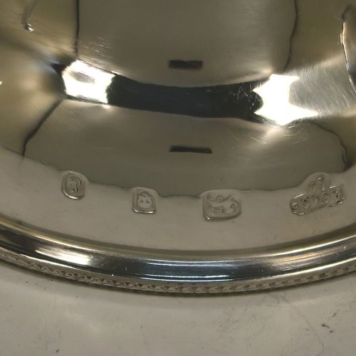 A handsome Sterling Silver wine decanting funnel, having a plain round body with applied bead borders, a plain side clip, and removable funnel. this elegant silver wine decanting funnel was made by A. Chick and Sons Ltd., of London in 1979. The dimensions of this fine hand-made silver wine decanting funnel are height 13.5 cms (5.3 inches), diameter of bowl 8 cms (3 inches), and it weighs approx. 66g (2 troy ounces).